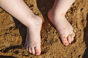 baby feet in the sand