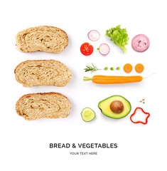 Creative layout made of bread and vegetables. Flat lay. Food concept. Macro  concept. Bread, tomatoes, cucumber, avocado, carrot, red pepper, onion and salad leaves on white background.
