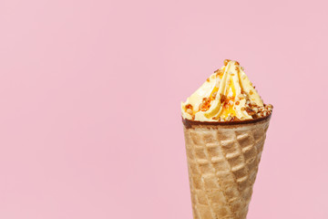 Ice Cream in a waffles cone on color background.