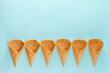 Ice cream cones pattern. Waffle cones on  Background. Minimal composition.