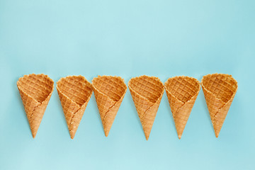 Ice cream cones pattern. Waffle cones on  Background. Minimal composition.