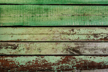 Old, dingy surface, flaking green paint