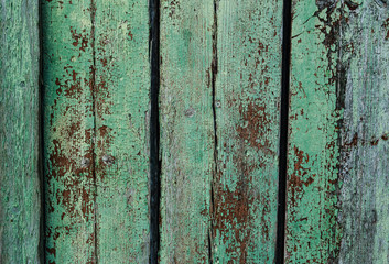 Old, dingy surface, flaking green paint