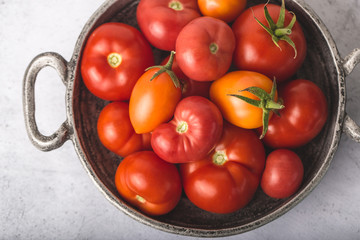 tomatoes in metal bowl