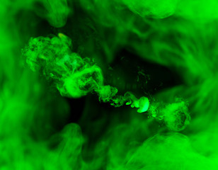 fusion of green smoke in motion isolated on black background