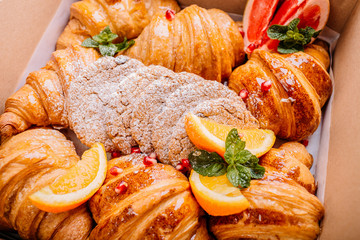 Breakfast with croissants, cereals and fruits.Top View
