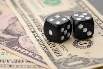 Playing Dices and Stack of American Dollars Bills.