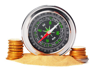 stacking coins with compass .money saving concept