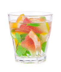 cold drink with different citrus and herbs in glasses on a white background. Cocktail