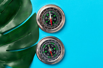 Compass on blue background, top view