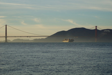 SAN FRANCISCO, CALIFORNIA, UNITED STATES - NOV 25th, 2018: MSC Cargo Ship SILVIA entering the San Francisco Bay under the Golden Gate Bridge on its way to the Port of Oakland - a fully loaded
