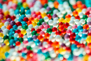 multicolored candy on a green background