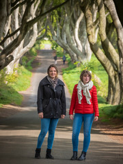 Two girls visit the Dark Hedges on their trip through North Ireland - travel photography