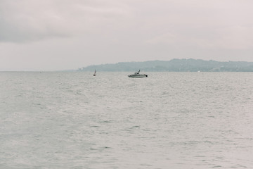 Fototapeta na wymiar yacht in the Black Sea on a cloudy day