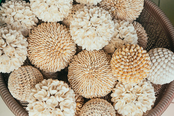 Decorated hand made flowers of shells in Bali shop