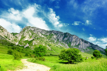 Beautiful landscape with a tourist and bike path and a nice cludscape near to Torocko in Transylvania, Romania