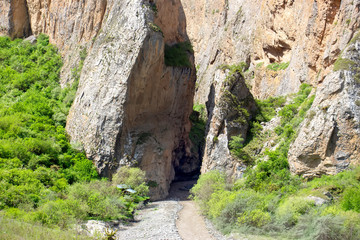 The river flows between the mountains