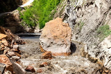 The river flows between the mountains