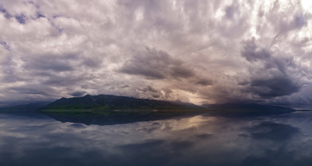 Obraz premium Amazing cloud over the mountains. dramatic storm over the lake and mountains. Adventure for hiking, climbing and other outdoor sports
