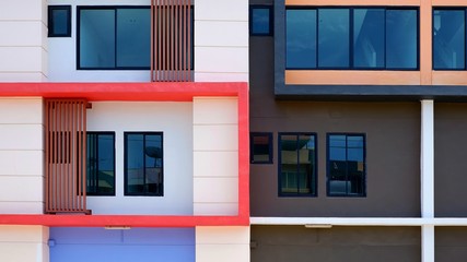 Fragment of rectangle and lines pattern of glass windows with baluster on modern building in the city, exterior architecture decoration design concept