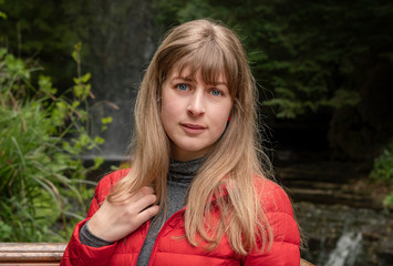 Portrait shot of a young 25 year old woman in the nature - travel photography