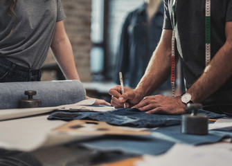 Obraz premium Fashion designer working in his studio