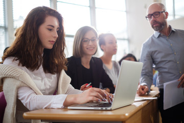 Lecturer and multinational group of students in an auditorium
