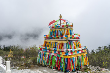 Colorful prayer tower on the top of the 4th camp of Hailuogou Glacier Forest Park