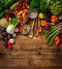 Assortment of fresh vegetables on wooden background