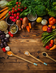 Assortment of fresh vegetables on wooden background