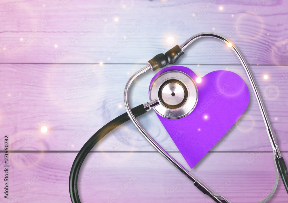 Wall mural medical stethoscope with heart isolated on background