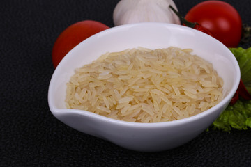 Raw uncooked rice in the bowl