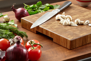 Beautiful wooden cutting board and a large knife