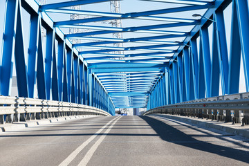 modern bridge construction and road going through the bridge