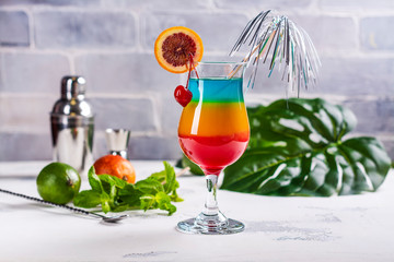 Summer rainbow layered cocktail