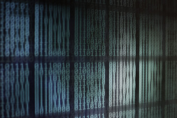 Binary code computer theme background. selective focus image of led display showing computer language matrix. out of focus circular light in the back.