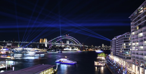 Sydney, Australia - May 27, 2019. Sydney Harbour Bridge at Circular Quay illuminated with colourful light design imagery during the Vivid Sydney 2019 free annual public event.