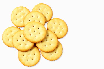 Top view of round salted snack cracker cookie isolated on white background