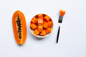 Ripe papaya fruit on white background.