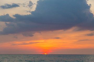 big family in sea at sunset 