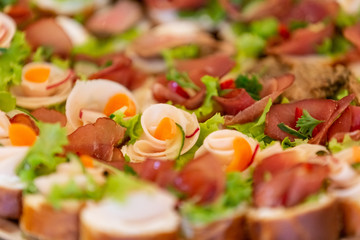 Appetizing bruschetta with ham and vegetables.