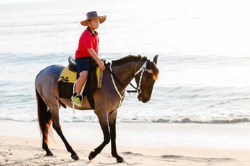 horse ride on the beach on a sunny day.
