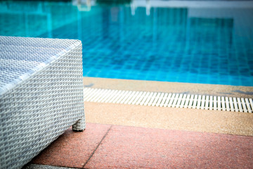 wicker rattan pool sun bed deckchair at swimming pool