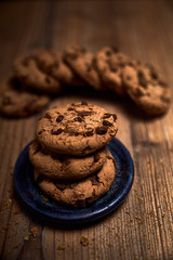 group of tasty cookies next to a bowl