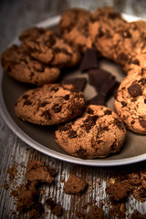 group of tasty cookies next to a bowl