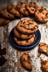 group of tasty cookies next to a bowl