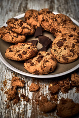 group of tasty cookies next to a bowl