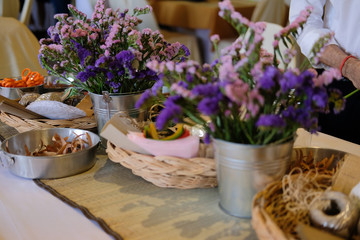 man florist arranging flower decoration for banquet