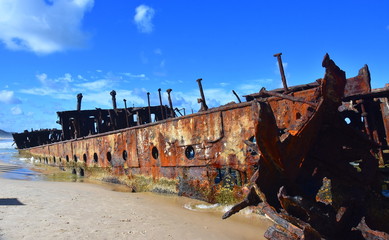 The rusty wreck of the vessel Maheno on the shores of Fraser Island (Queensland, Australia). The...
