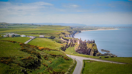 Fototapeta na wymiar Aerial view over famous Dunluce Castle in North Ireland - travel photography